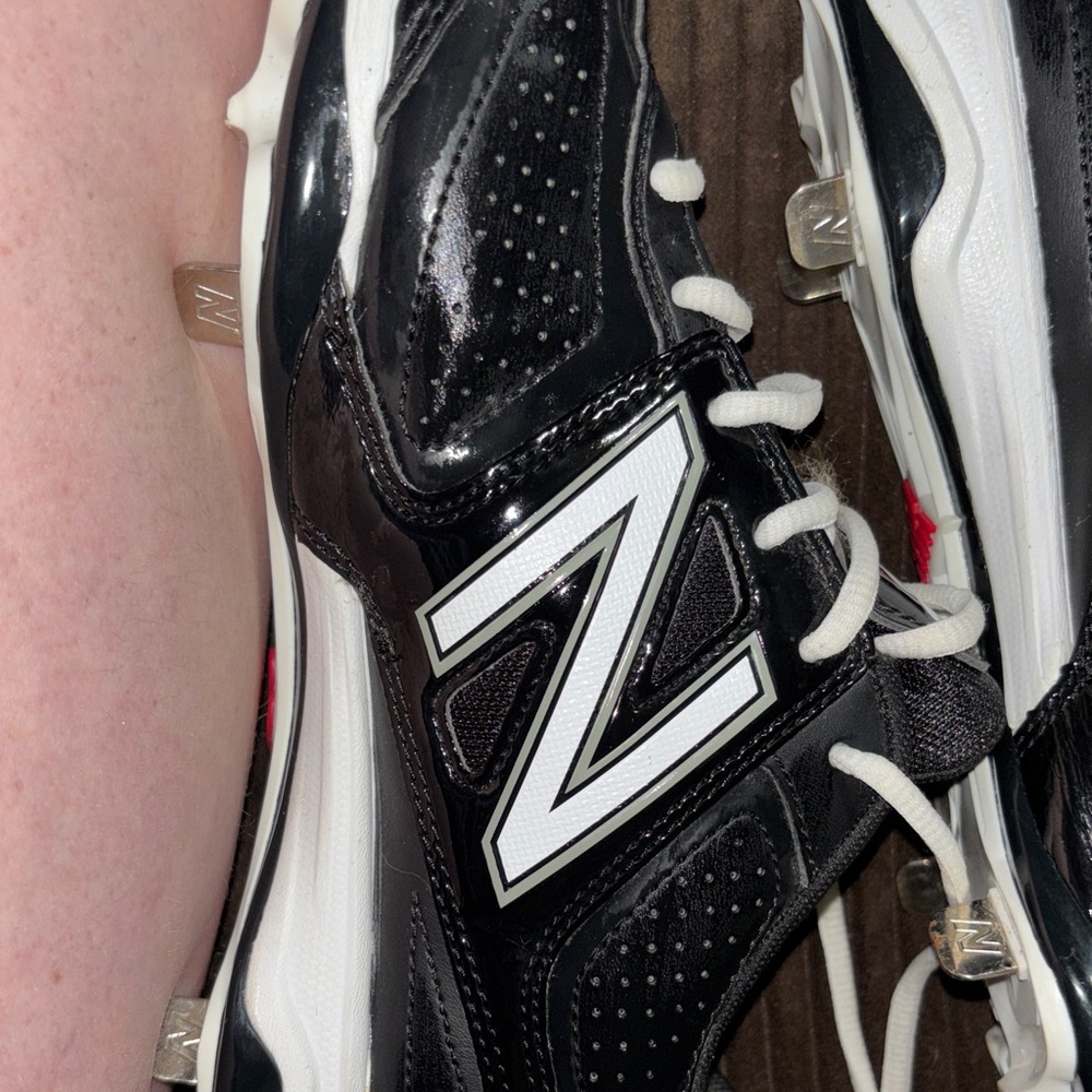 New Balance Black and White Baseball Cleats with Prominent N Logo